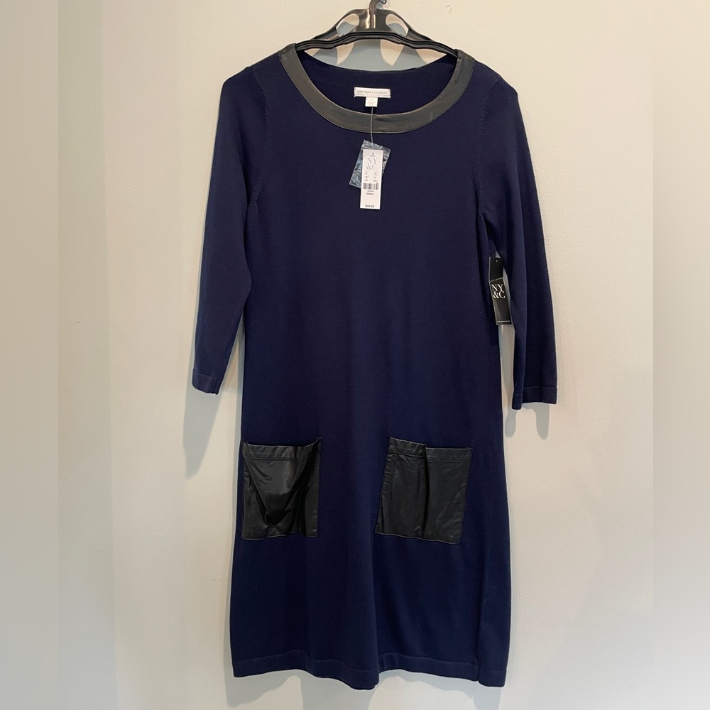 3/4 sleeve navy dress with black faux leather trim on scoop neck & front pockets
